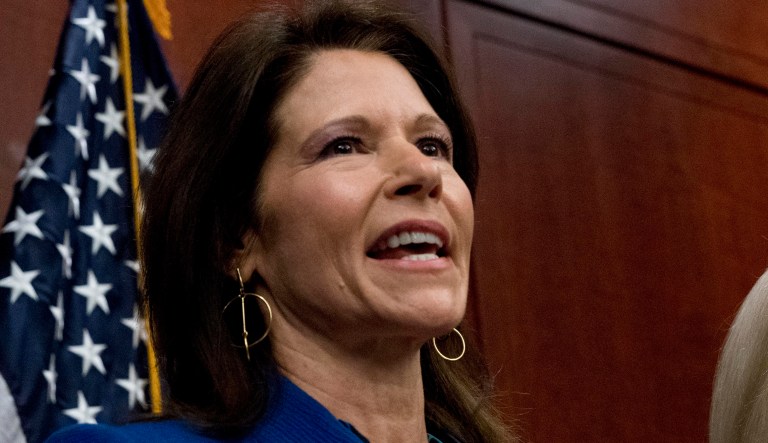 Rep. Cheri Bustos, D-Ill., left, and Sen. Kirsten Gillibrand, D-N.Y., right, speak at a news conference where members of congress have introduced legislation to curb sexual harassment in the workplace, on Capitol Hill, Wednesday, Dec. 6, 2017, in Washington. Gillibrand and fellow female Democratic senators have united in calling for Sen. Al Franken to resign amid sexual misconduct allegations.