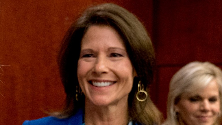 Rep. Cheri Bustos, D-Ill, smiles as she finishes speaking at a news conference.