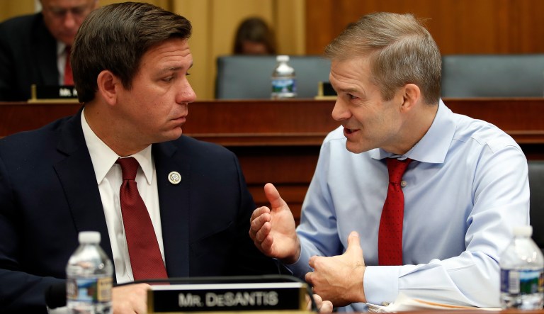 House Judiciary Committee member Rep. Jim Jordan, R-Ohio, right, and Rep. Ron Desantis, R-Fla., talk as FBI Director Christopher Wray testifies during a House Judiciary hearing on Capitol Hill in Washington, Thursday, Dec. 7, 2017, on Oversight of the Federal Bureau of Investigation. 