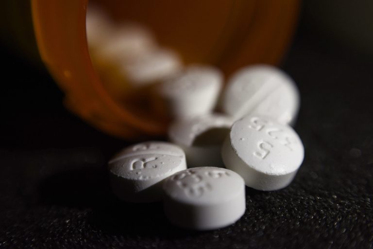 This Tuesday, Aug. 15, 2017 photo shows an arrangement of pills of the opioid oxycodone-acetaminophen in New York. Abuse of painkillers, heroin, fentanyl and other opioids across the country has resulted in tens of thousands of children being taken from their homes and placed in the foster care system. 