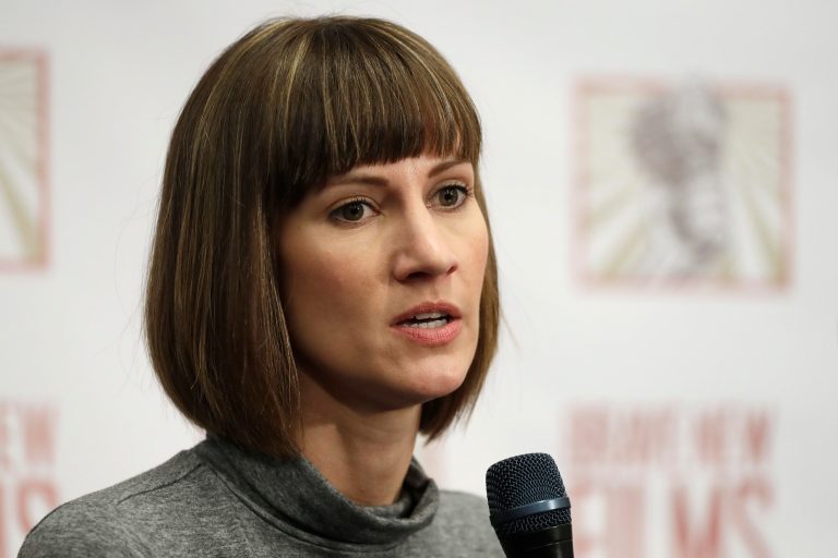 Rachel Crooks speaks at a news conference, Monday, Dec. 11, 2017, in New York to discuss her accusations of sexual misconduct against Donald Trump. The women, who first shared their stories before the November 2016 election, called for a congressional investigation into Trump's alleged behavior.