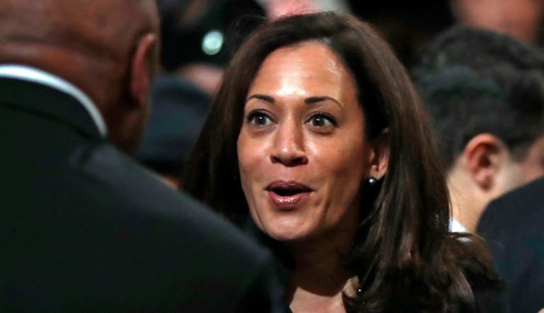 Sen. Kamala Harris, right, greets former San Francisco Mayor Willie Brown after a service celebrating the life of Mayor Ed Lee at San Francisco City Hall in San Francisco, Sunday, Dec. 17, 2017. 