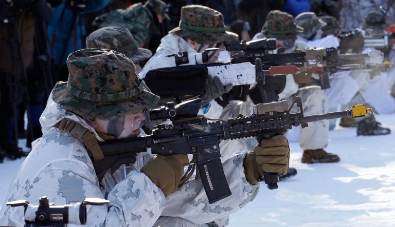 South Korean and U.S. Marines from III Marine Expeditionary Force from Okinawa, Japan, fire their machine guns during their joint military winter exercise in Pyeongchang, South Korea, Tuesday, Dec. 19, 2017. More than 400 marines from the two countries participated in the Dec. 4-22 joint winter exercise in South Korea.