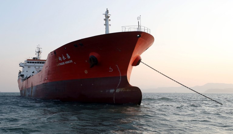 The Lighthouse Winmore, a Hong Kong-flagged ship, is seen in waters off Yeosu, South Korea, Friday, Dec. 29, 2017. South Korean authorities boarded the Hong Kong-flagged ship and interviewed its crew members for allegedly violating U.N. sanctions by transferring oil to a North Korean vessel in October, an official said Friday.