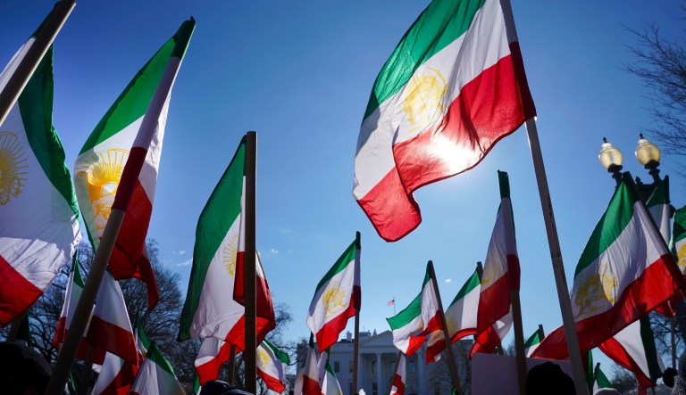 Demonstrators hold Iranian flags during a rally in Lafayette Park across from the White House in Washington, on Saturday, Jan. 6, 2018, in solidarity with anti-government demonstrators in Iran. Iran has seen its largest anti-government protests since the disputed presidential election in 2009.