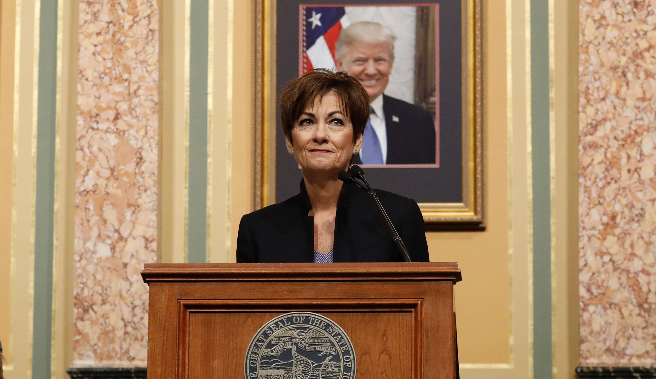 Iowa Gov. Kim Reynolds signs insurance bill