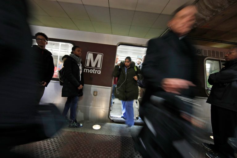 Riders wait to board as others depart a Metro train in the Gallery Place-Chinatown Metro Station, Thursday, Jan. 11, 2018, in Washington. Despite having the highest average pay in the government, many Washington federal workers expressed dissatisfaction with their salaries in a new report.
