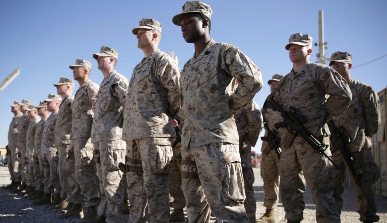 U.S. Marines stand guard during the change of command ceremony at Task Force Southwest military field in Shorab military camp of Helmand province, Afghanistan, Monday, Jan. 15, 2018. 