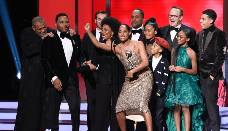 The cast and crew of "black-ish" accepts the award for outstanding comedy series at the 49th annual NAACP Image Awards at the Pasadena Civic Auditorium on Monday, Jan. 15, 2018, in Pasadena, Calif. Pictured from left are Laurence Fishburne, Anthony Anderson, Jeff Mecham, Jenifer Lewis, Tracee Ellis Ross, Kenya Barris, Yara Shahidi, Miles Brown, Peter Mackenzie, Marsai Martin, and Marcus Scribner.