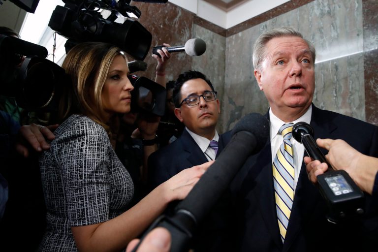 Sen. Lindsey Graham, R-S.C., right, speaks to the media after attending a bipartisan meeting of senators, Monday Jan. 22, 2018, on Capitol Hill in Washington on Day Three of the government shutdown.