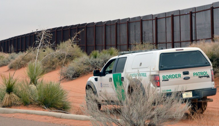 A U.S. Border Patrol vehicle drives next to a U.S-Mexico border fence in the booming New Mexico town of Santa Teresa.