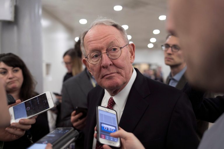 Sen. Lamar Alexander, R-Tenn., chairman of the Senate Health, Education, Labor, and Pensions Committee, speaks with reporters during a vote on the confirmation of Samuel Brownback, governor of Kansas and a former U.S. senator, to become the ambassador-at-large for international religious freedom, at the Capitol in Washington, Wednesday, Jan. 24, 2018.