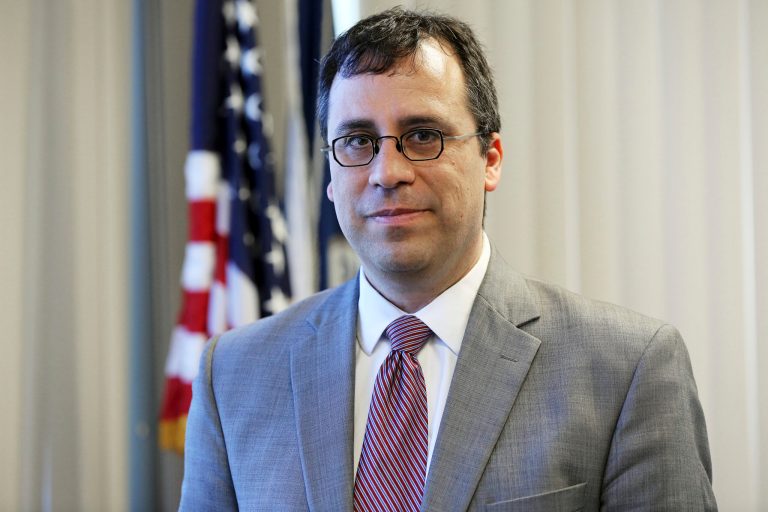 L. Francis Cissna, director of U.S. Citizenship and Immigration Services, poses in his office.
