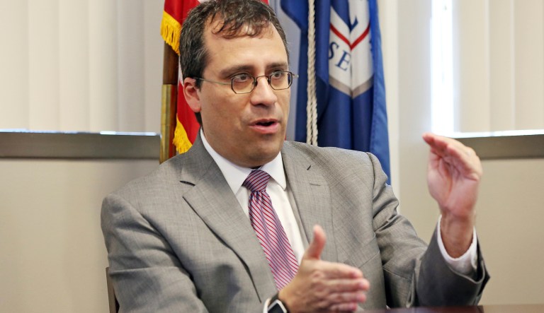 This Dec. 13, 2017 photo shows L. Francis Cissna, director of U.S. Citizenship and Immigration Services, during an interview in his office in downtown Los Angeles Wednesday. In this December interview, Cissna said that he hoped to stem the growing backlog in asylum applications to prevent fraud and enable those truly fleeing persecution to settle here. On Wednesday, Jan. 31, 2018, the agency announced plans to start reviewing newer asylum applications first and pushing those already waiting years toward the back of the line.