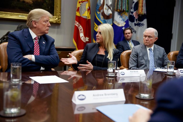 President Donald Trump, left, and Attorney General Jeff Sessions, right, listen as Florida Attorney General Pam Bondi speaks during a meeting with state and local officials to discuss school safety, in the Roosevelt Room of the White House, Thursday, Feb. 22, 2018, in Washington.