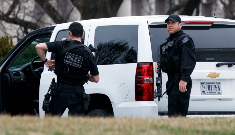Secret Service officers stand on the North Lawn of the White House in Washington, D.C.
