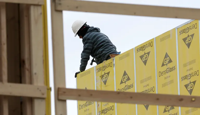 FILE- In this Monday, Feb. 26, 2018, photo, work continues on a new development in Fair Lawn, N.J. On Friday, March 9, the Labor Department reported that U.S. employers added 313,000 jobs in February, the most in any month since July 2016, and drawing hundreds of thousands of people into the job market. 