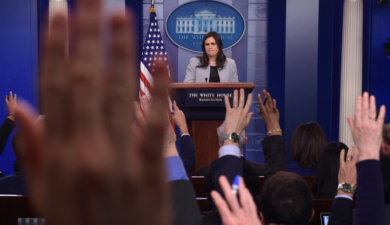 White House press secretary Sarah Huckabee Sanders listens to a reporter's question during the daily briefing at the White House in Washington.