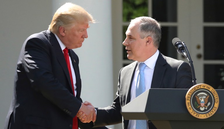 President Trump shakes hands with EPA Administrator Scott Pruitt after speaking about the U.S. role in the Paris climate change accord. 