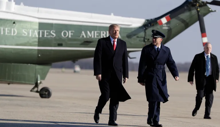 President Donald Trump boards Air Force One in Andrews Air Force Base, Md.