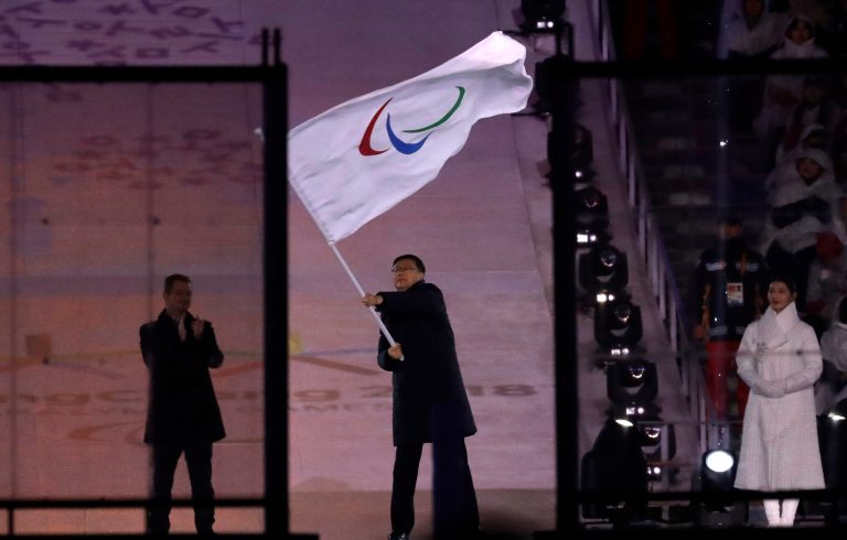 Chen Jining, mayor of Beijing, waves the Paralympic flag after receiving it from Andrew Parsons, President of the International Paralympic Committee during the closing ceremony of the 2018 Winter Paralympics in Pyeongchang, South Korea on March 18. 