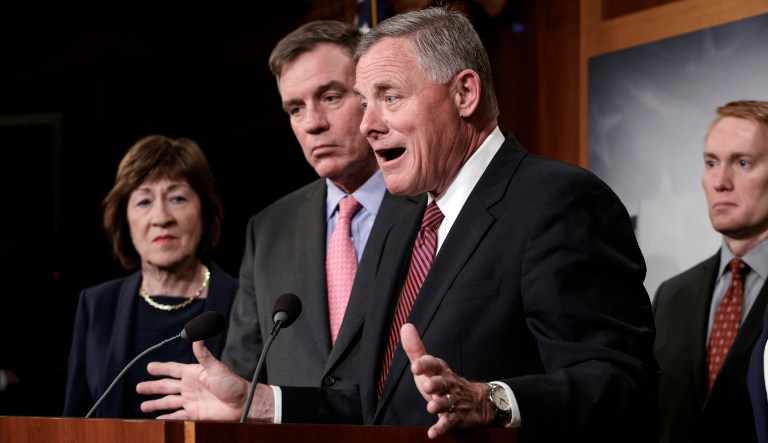Senate Intelligence Committee Chairman Sen. Richard Burr, R-N.C., center, joined from left by, Sen. Susan Collins, R-Maine, Vice Chairman Mark Warner, D-Va., and Sen. James Lankford, R-Okla., previews some of the panel's recommendations for improving the nation's election infrastructure ahead of the 2018 midterm elections. 