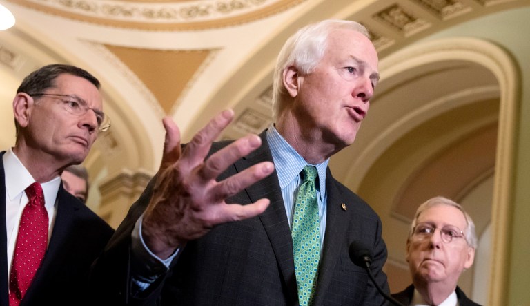 Senate Majority Whip John Cornyn, R-Texas, center, joined from left by Sen. John Barrasso, R-Wyo., and Majority Leader Mitch McConnell, R-Ky., speaks to reporters.