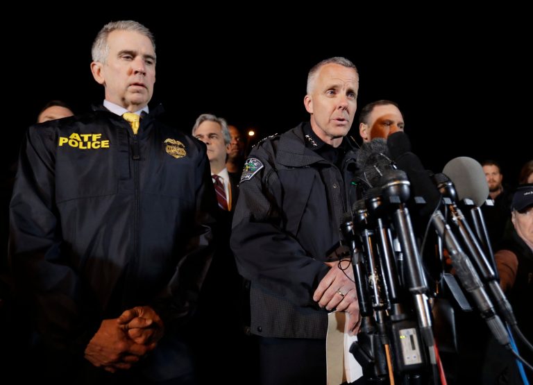 Interim Austin Police Chief Brian Manley, right, stands with other members of law enforcement as he briefs the media, Wednesday, March 21, 2018, in the Austin suburb of Round Rock, Texas.