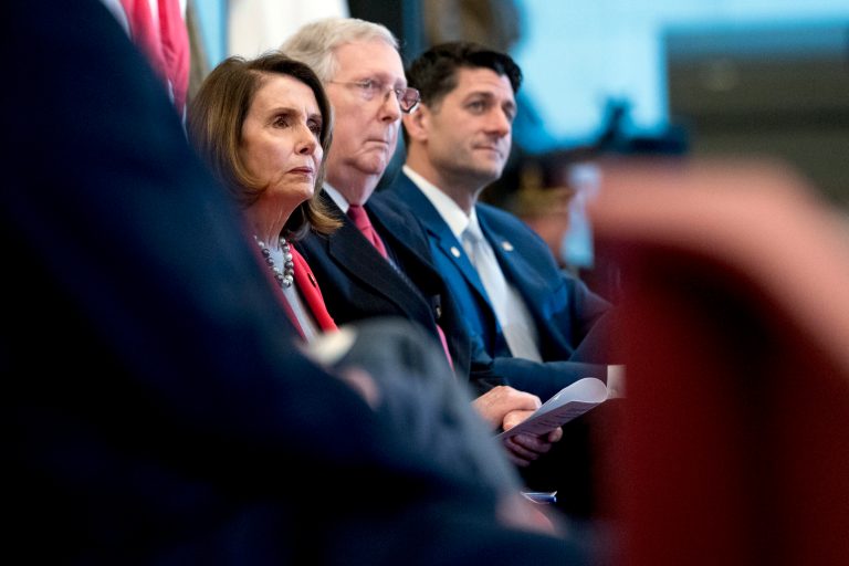 From left, House Minority Leader Nancy Pelosi of Calif., Senate Majority Leader Mitch McConnell of Ky., and House Speaker Paul Ryan of Wis., appear for a Congressional Gold Medal Ceremony honoring the Office of Strategic Services in Emancipation Hall on Capitol Hill in Washington, Wednesday, March 21, 2018.