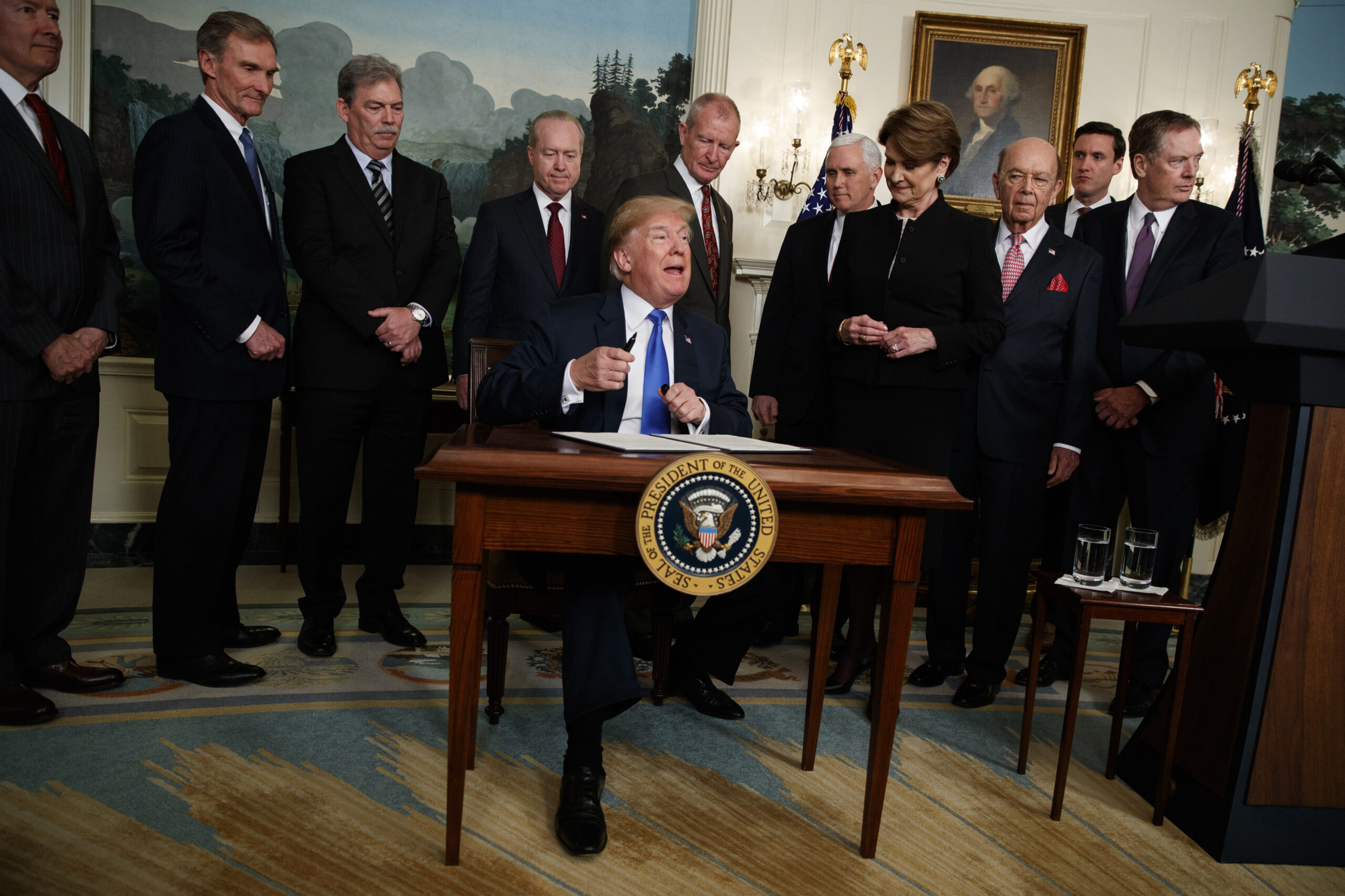 Why is Trump so eager to compete with China in tax-hiking?