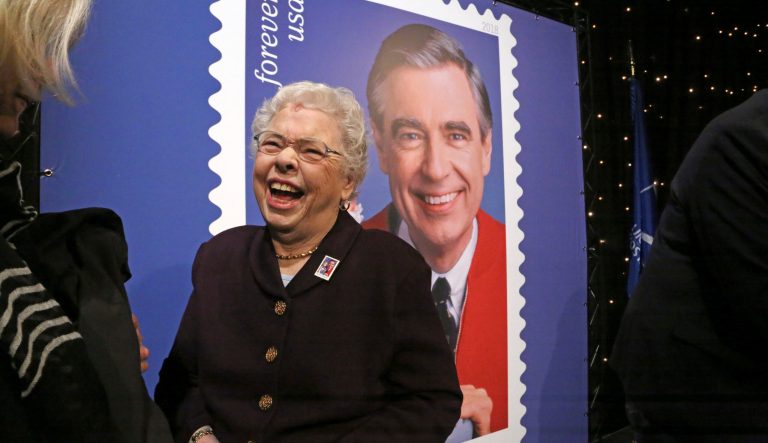 Fred Rogers wife, Mrs. Joanne Rogers shares a laugh with friends as they visit in front of a giant Mister Rogers Forever Stamp following the first-day-of-issue dedication in WQED's Fred Rogers Studio in Pittsburgh, Friday, March 23, 2018. 