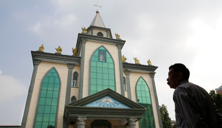 A man stands outside the Hepo underground Catholic church in Jiexi county in south China's Guangdong province.