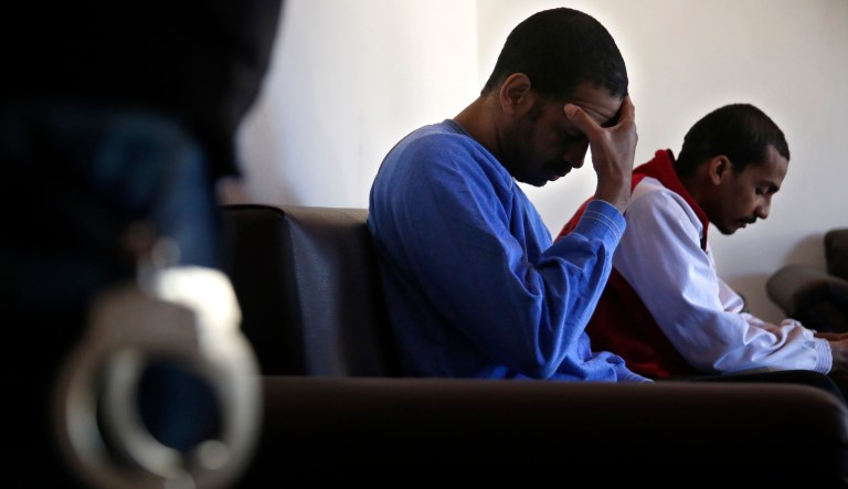 Alexanda Amon Kotey and El Shafee Elsheikh, who were allegedly among four British jihadis who made up a brutal Islamic State cell dubbed "The Beatles," sit on a sofa during a media interview on March 30, 2018.