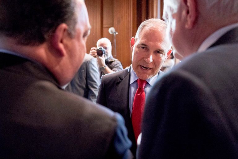 Environmental Protection Agency Administrator Scott Pruitt speaks with auto industry leaders following a news conference at the Environmental Protection Agency in Washington, Tuesday, April 3, 2018, on his decision to scrap Obama administration fuel standards.