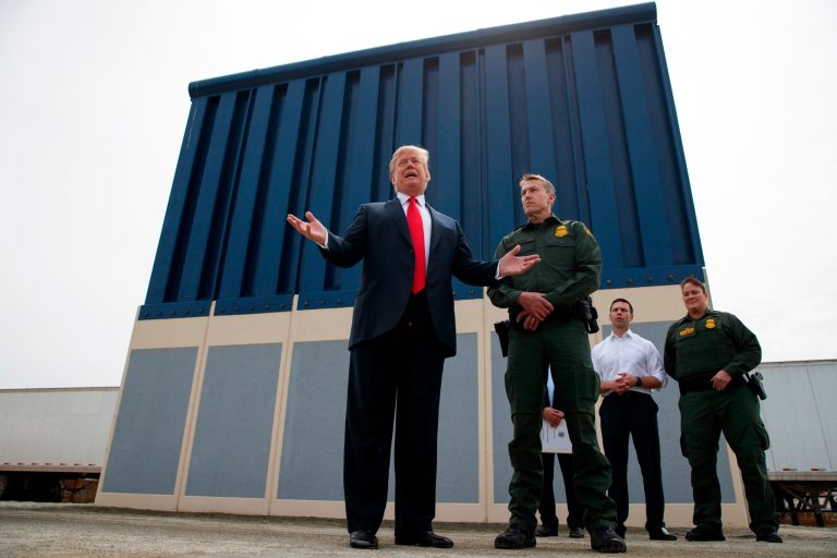 President Donald Trump talks with reporters as he reviews border wall prototypes in San Diego in March.