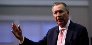 Republican Gov. John Kasich, a former 2016 Presidential hopeful, gestures during a visit to New England College in Henniker, N.H., Tuesday, April 3, 2018.  