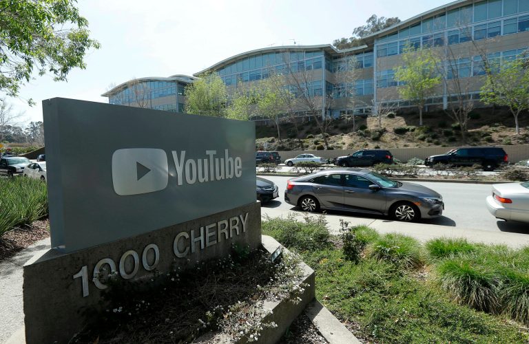 A YouTube sign is shown across the street from the company's offices in San Bruno, Calif.
