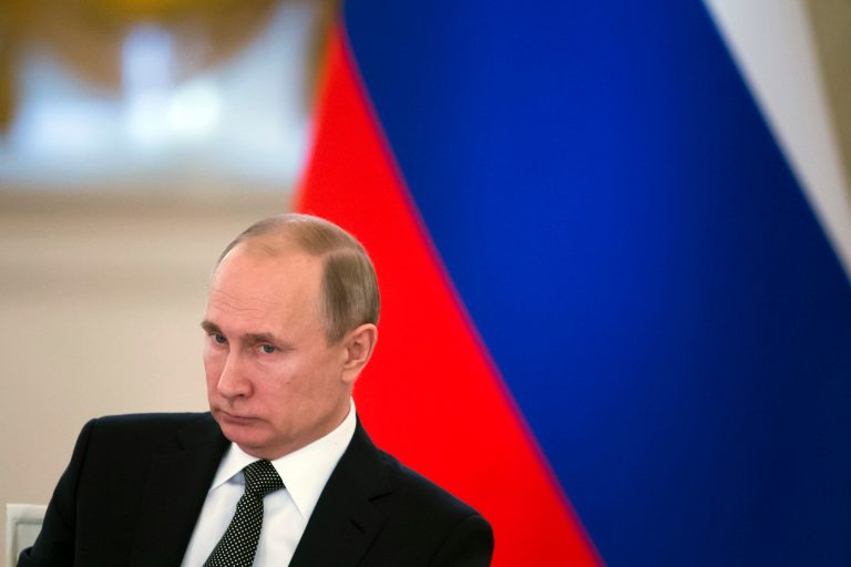Russian President Vladimir Putin sits during a meeting of the State Council in the Kremlin.