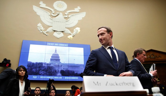 Facebook CEO Mark Zuckerberg returns after a break to continue testifying at a House Energy and Commerce hearing on Capitol Hill in D.C.