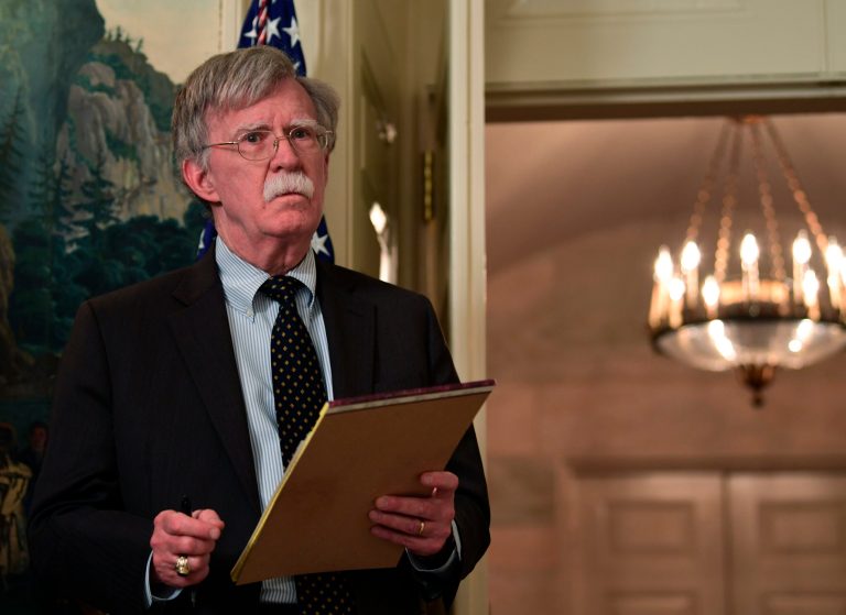 National security adviser John Bolton listens as President Donald Trump speaks in the Diplomatic Reception Room of the White House on Friday, April 13, 2018, in Washington, about the United States' military response to Syria's chemical weapon attack on April 7.