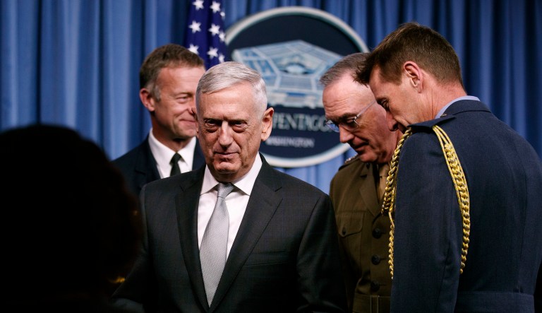 Defense Secretary Jim Mattis, second from left, and Joint Chiefs Chairman Gen. Joseph Dunford, second from right, leave the podium with and Air Vice Marshall Gavin Parker, Defence Attache British Embassy, right and French defence attache Brig. Gen. Jean-Pierre Montegu, left, walk from the stage at the conclusion of a news conference at the Pentagon, Friday, April 13, 2018.