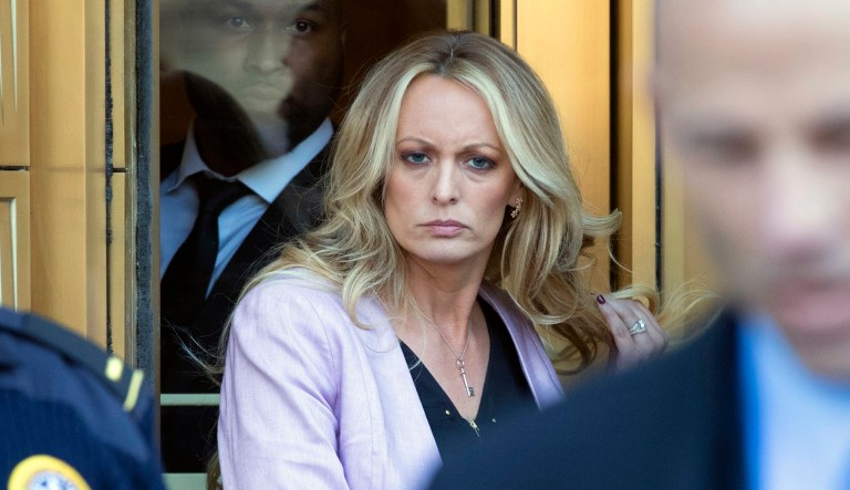 Porn star Stormy Daniels follows her attorney Michael Avenatti as she leaves federal court, April 16, 2018, in New York.