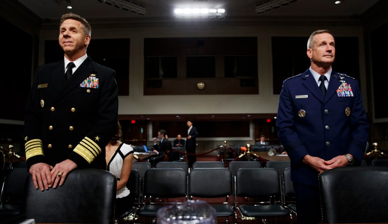 Navy Adm. Philip Davidson, left, Air Force Gen. Terrence O'Shaughnessy stand together before they testify during a Senate Armed Services Committee hearing on Capitol Hill in Washington. 