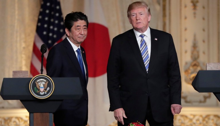 Japanese Prime Minister Shinzo Abe, left, and President Donald Trump, right, listen to a question from the media during a news conference at Trump's private Mar-a-Lago club, Wednesday, April 18, 2018, in Palm Beach, Fla.