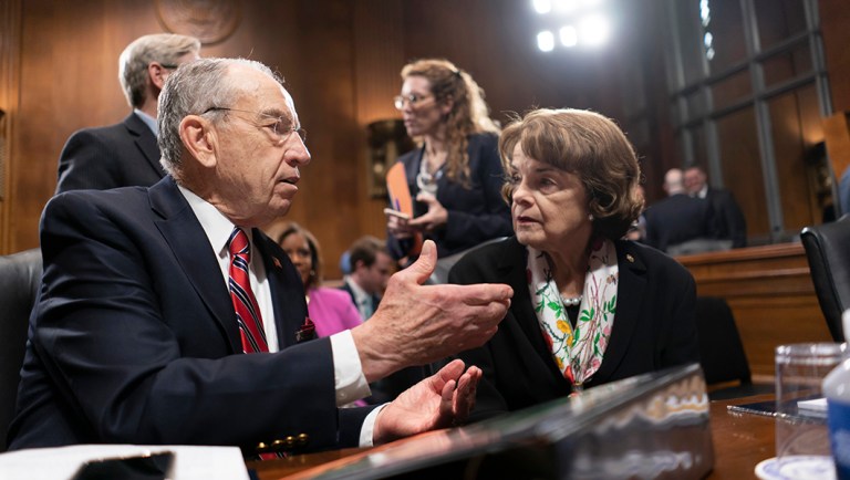 Senate Judiciary Committee Chairman Chuck Grassley, R-Iowa, joined at right by Sen. Dianne Feinstein, D-Calif., the ranking member, prepares to open a meeting of his panel to consider a bipartisan effort to protect special counsel Robert Mueller's job, on Capitol Hill in Washington, Thursday, April 19, 2018. Senate Majority Leader Mitch McConnell has said he will not hold a floor vote on the legislation even if it is approved next week in Judiciary. 