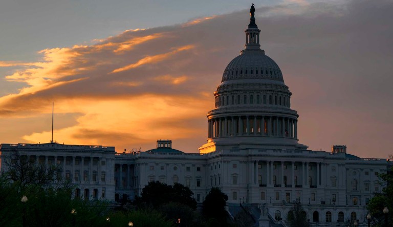 The sun rises behind Capitol Hill in Washington, Thursday, April 26, 2018.