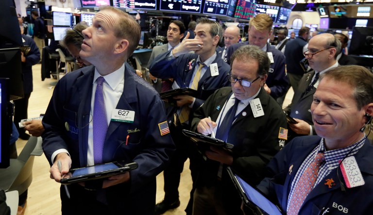 Traders gather on the floor of the New York Stock Exchange, Friday, May 4, 2018. Stocks opened moderately lower across the board, putting the market on track for its fourth loss this week. 