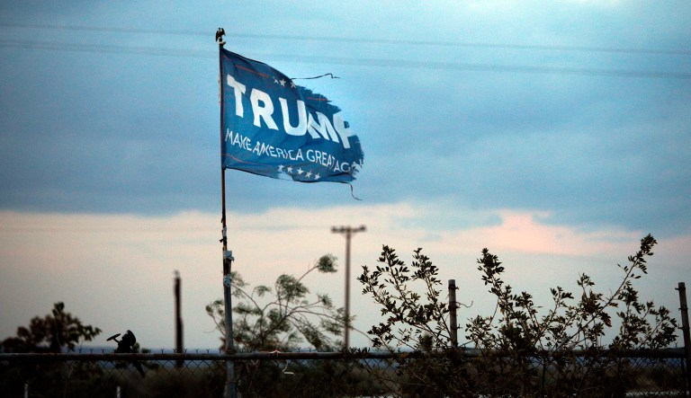 A withered Donald Trump campaign flag flies over a field on May 1, 2018, in Maricopa, Calif.