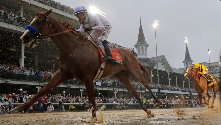 Mike Smith rides Justify to victory during the 144th running of the Kentucky Derby horse race at Churchill Downs Saturday, May 5, 2018, in Louisville, Ky.