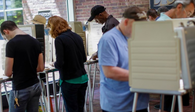 Voters fill out their ballots in Ohio. 